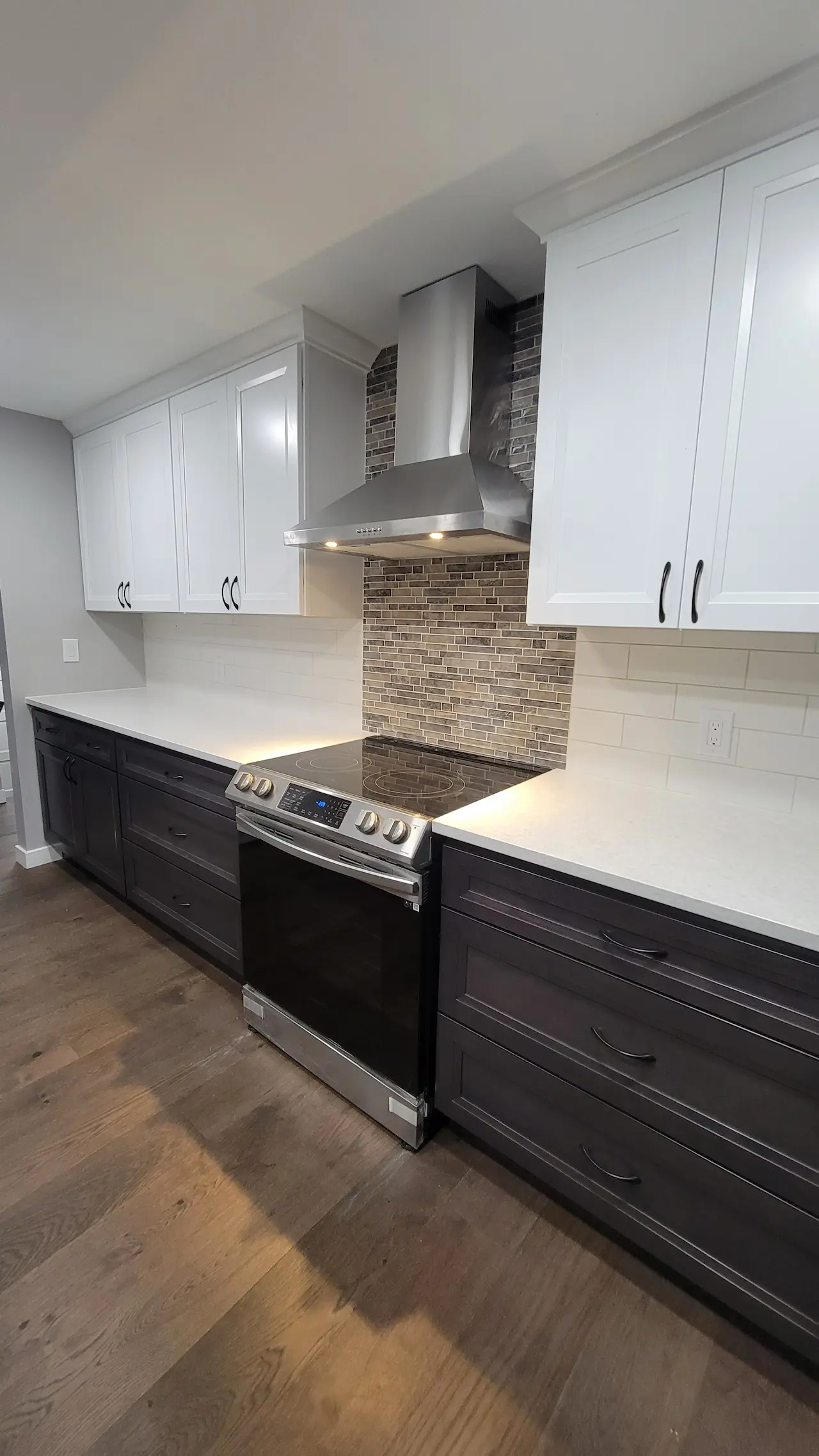 Tall slender porcelain bottle with natural clay textured body and cork stopper.